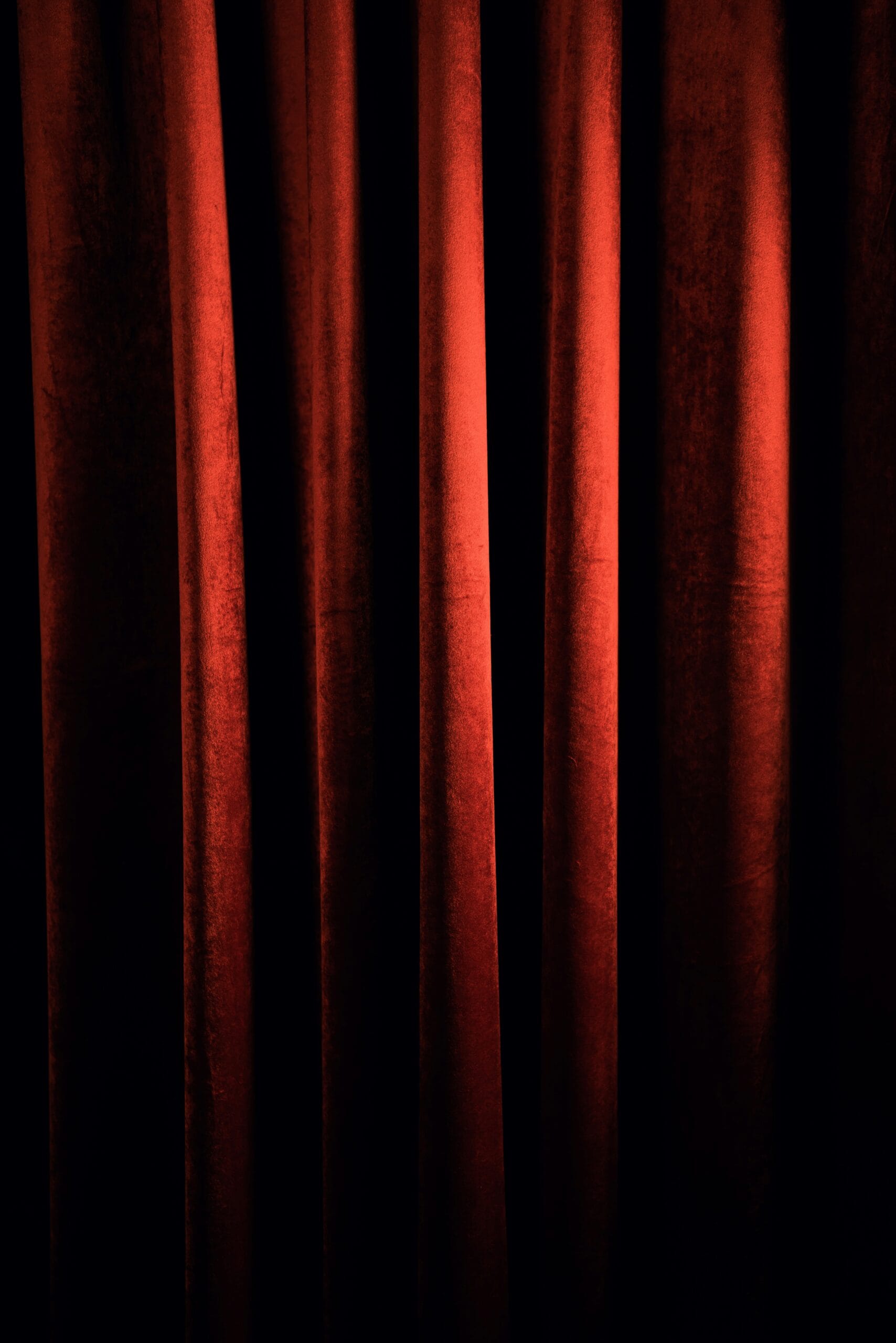 Heavy velvet soundproof curtains covering a bedroom window