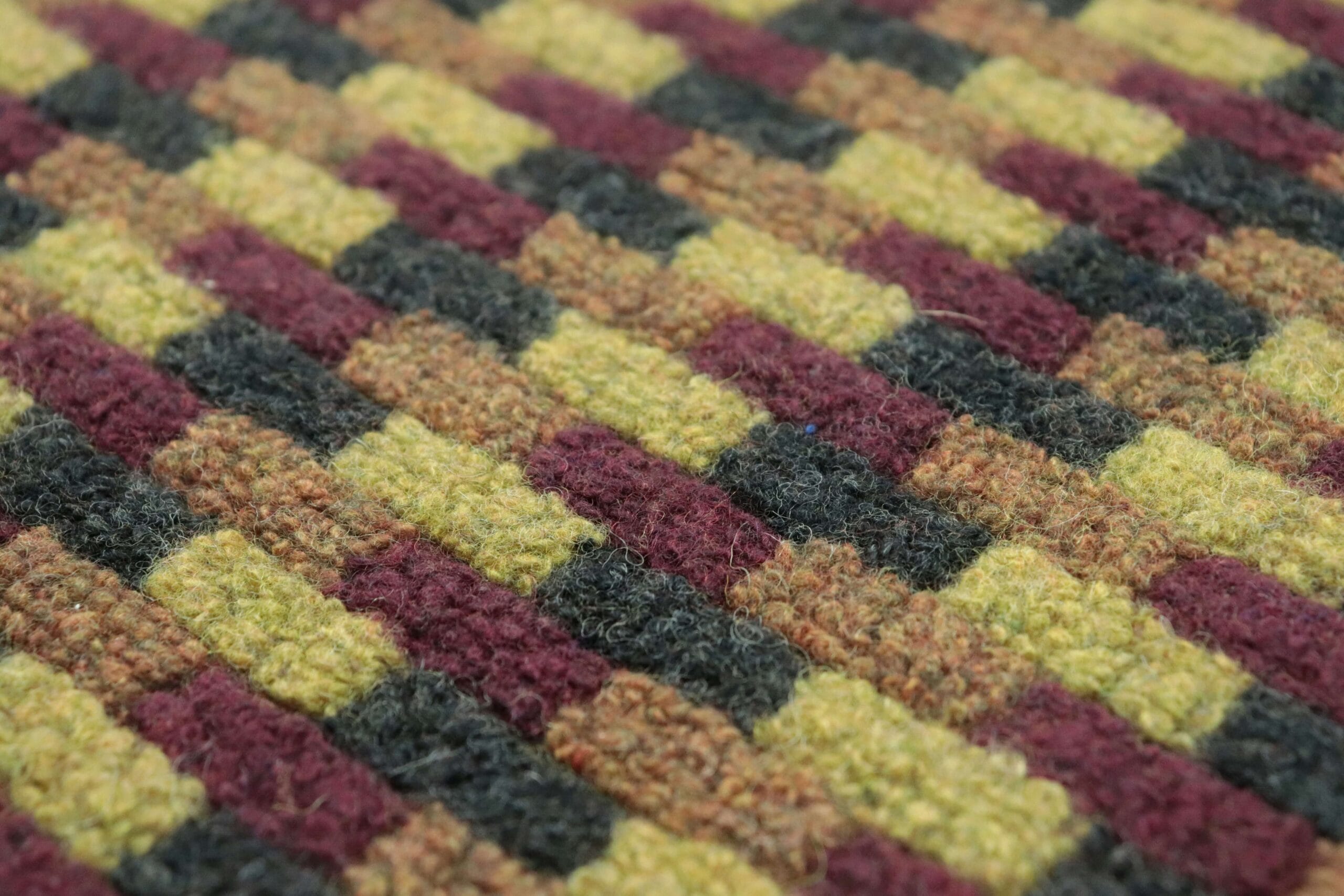 Thick 1/2 inch felt rug pad being rolled out on a wooden floor