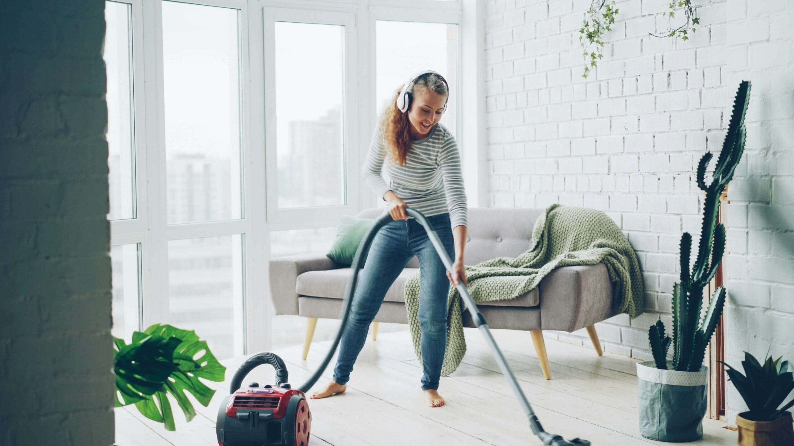 Woman vacuuming living room