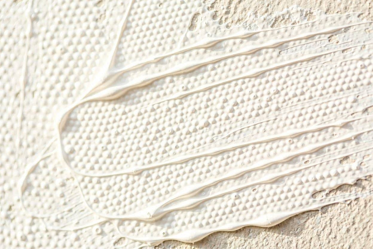 A close up macro shot of the textured microspheres inside sound absorbing acoustic paint