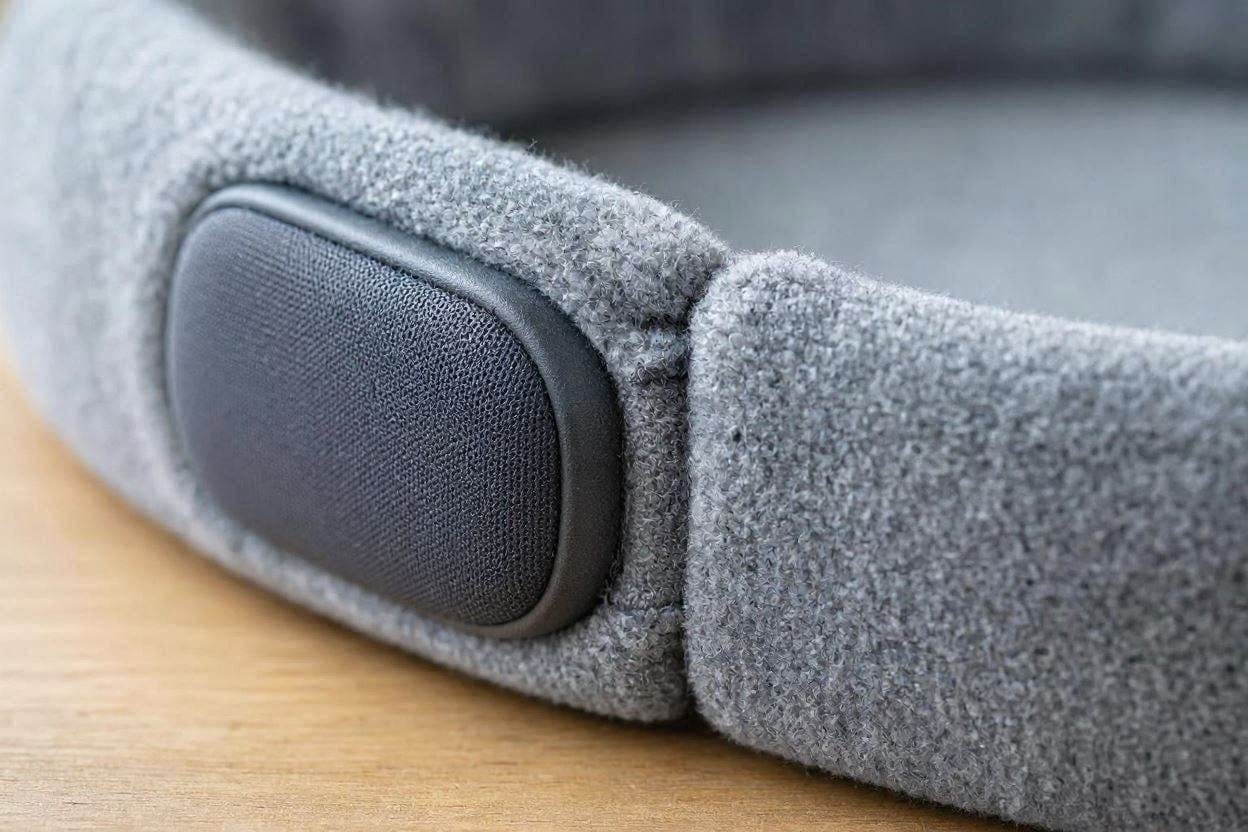 Close up view of flat, padded stealth speakers hidden inside a soft fleece sleep headband