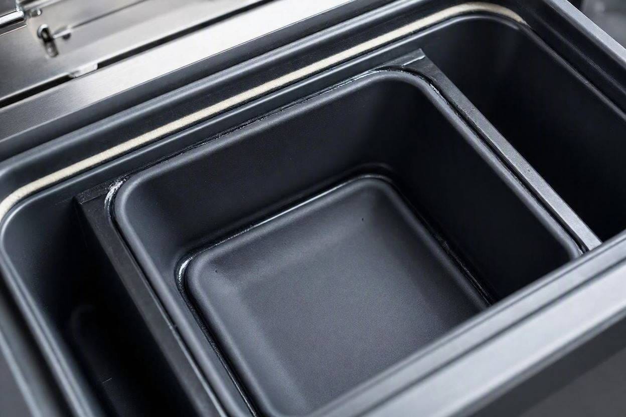 Close up of a sound-dampened ice basket designed to stop the loud clattering of dropping ice